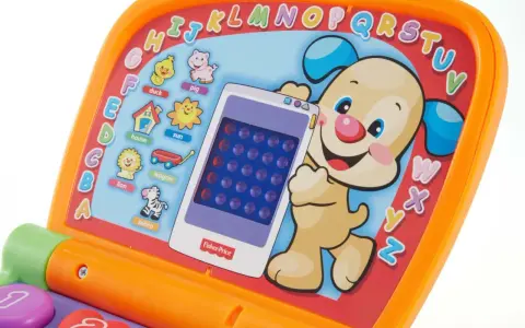 Kolorowy Fisher Price laptop z pieskiem i literkami. Uczy dzieci alfabetu i słówek.